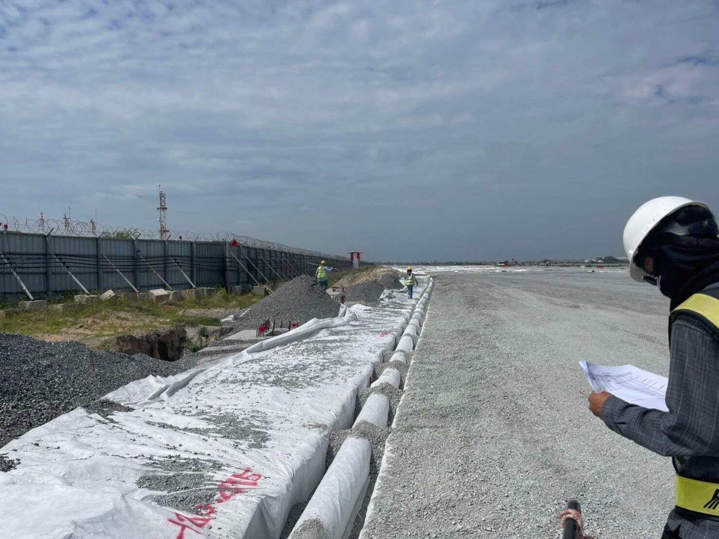 Engineer inspecting the installation of pipes at Suvarnabhumi Airport