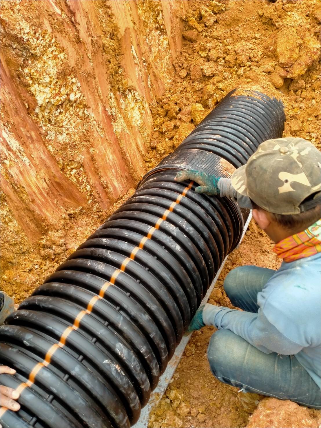 The engineer is checking the joints of the corrugated pipes ( TAPKORR ) in the industrial estate