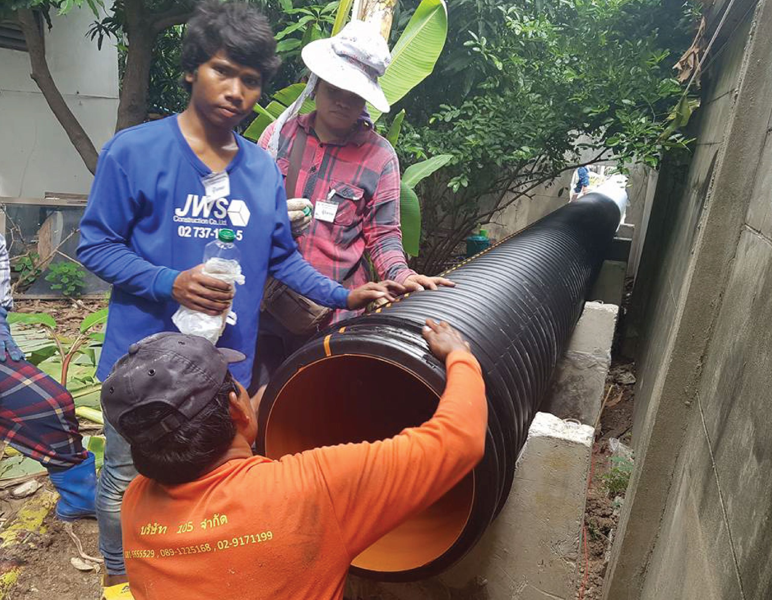 Engineer prepares to connect the TAPKORR pipe used to make a drainage.