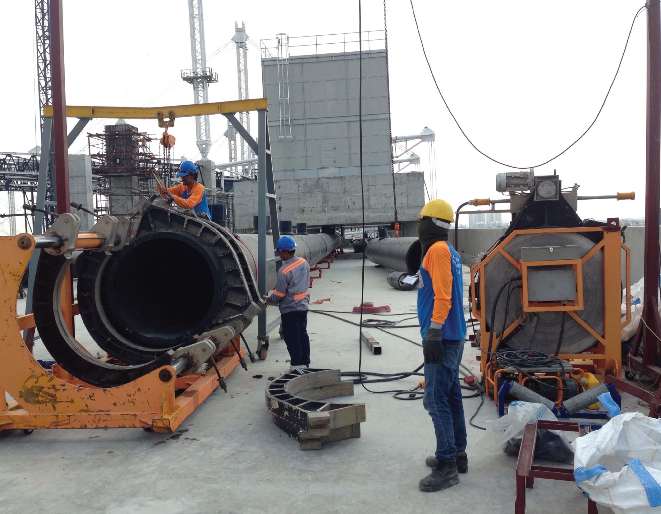 Engineer preparing a butt-fusion machine to weld HDPE pipes at BITEC Bangna