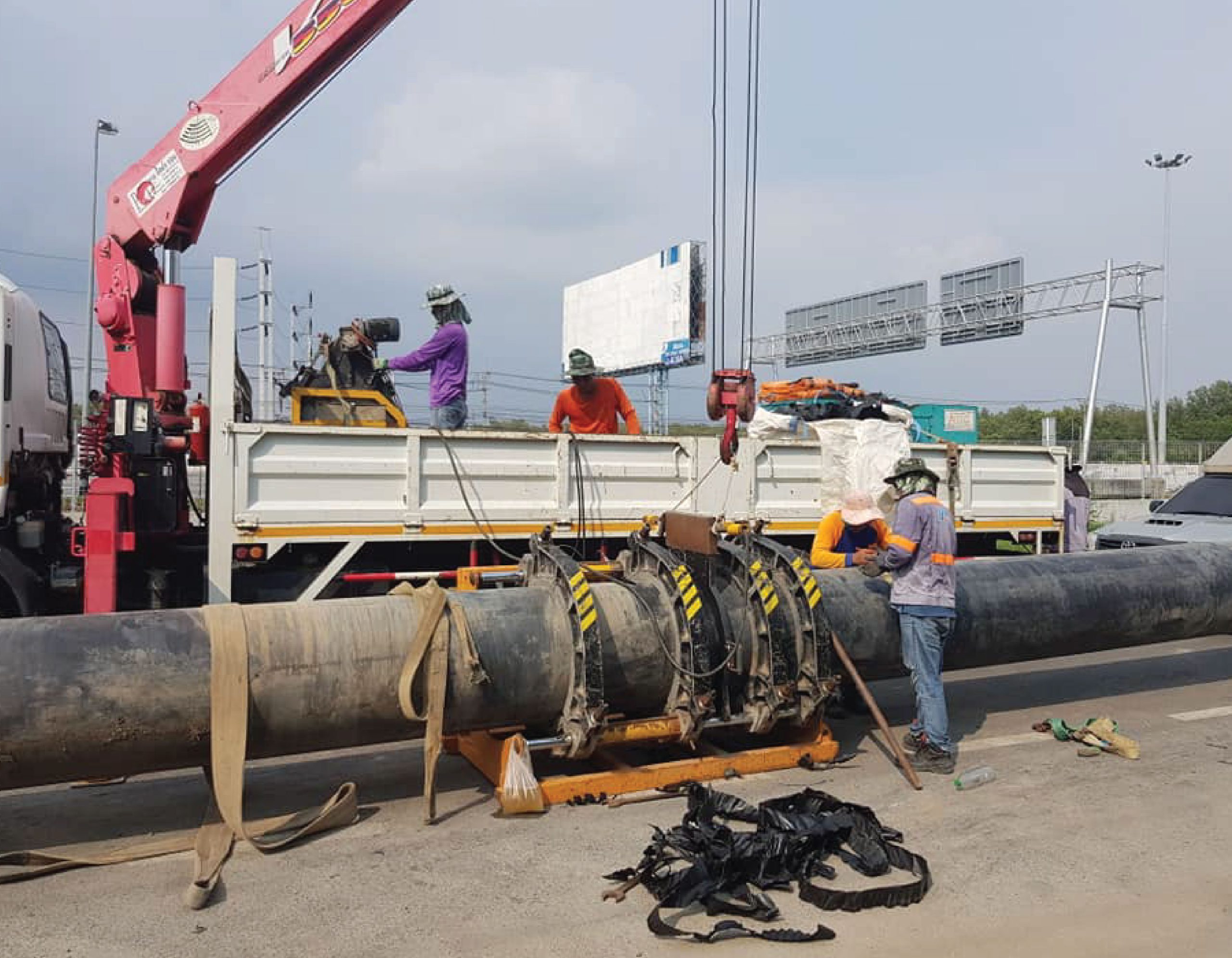 Engineers welding HDPE pipes using butt-fusion method to help drought in Bang Pakong