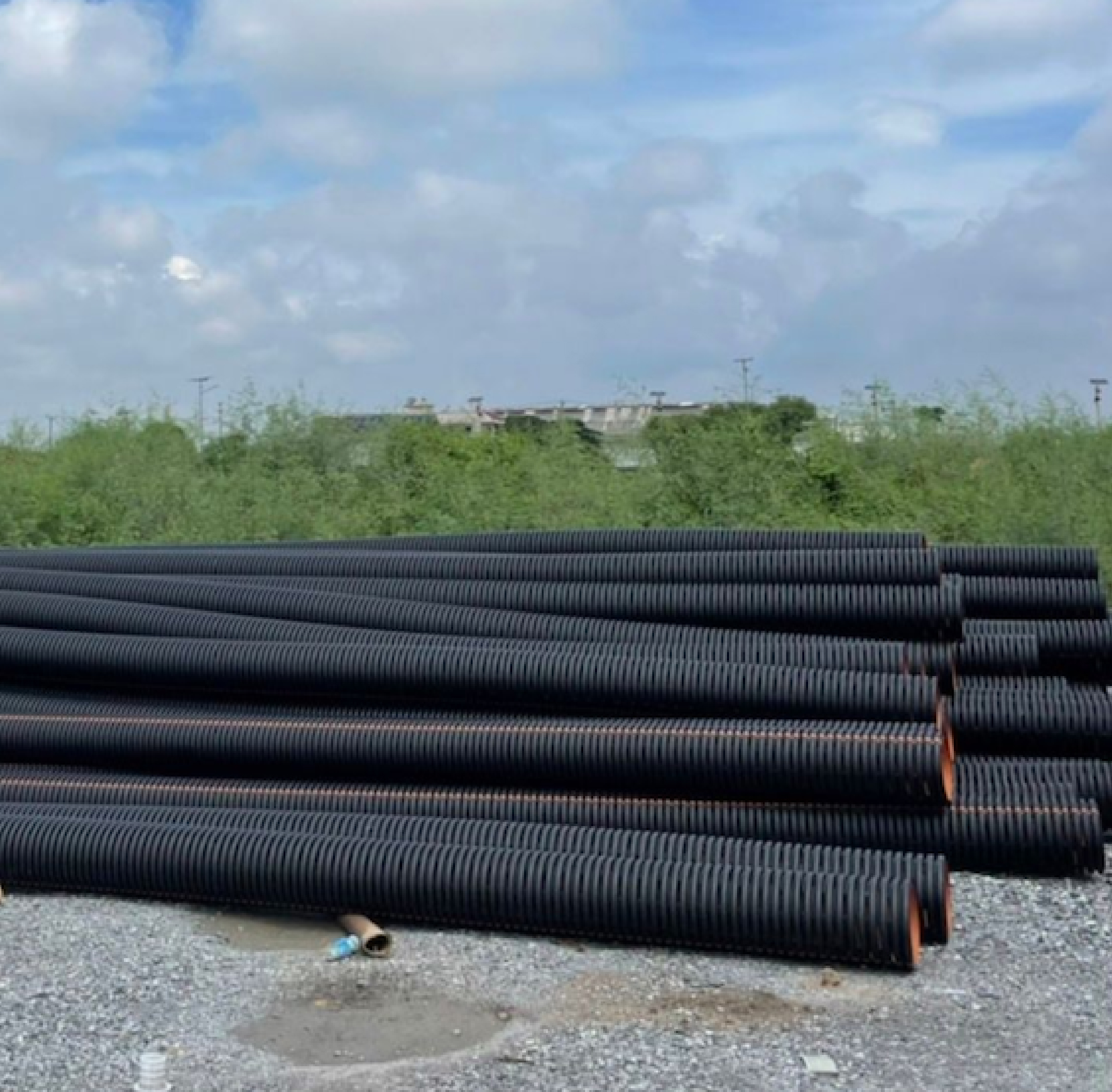 A coiled, flexible HDPE pipe used for versatile plumbing and irrigation applications